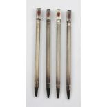 A SET OF FOUR SILVER COLOURED METAL AND ENAMEL BRIDGE SUITE MARKERS, each with a knurled shaft,