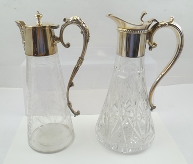 TWO CLARET JUGS with silver plated hinged cover mounts with integral handles, one with cut lead