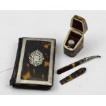 A LATE VICTORIAN TORTOISESHELL THIMBLE CASE of knife box design, contains a white metal thimble,