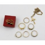 A SELECTION OF JEWELLERY, to include a gold coloured metal crucifix on a fancy faceted polished link