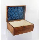 A VICTORIAN WALNUT VENEERED JEWEL/TRINKET BOX, having figured cushion top with inset handle,