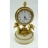 A "HALCYON DAYS" DECORATIVE FRENCH STYLE BOUDOIR CLOCK, having cast gilt brass frame as two putti