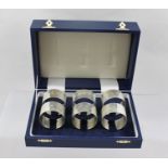 BROADWAY & CO. A SET OF SIX SILVER NAPKIN RINGS, un-engraved with display hallmarks, in blue vinyl