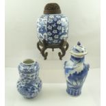 A CHINESE PORCELAIN GOURD SHAPED VASE, painted in cobalt blue with exotic birds amidst foliage,