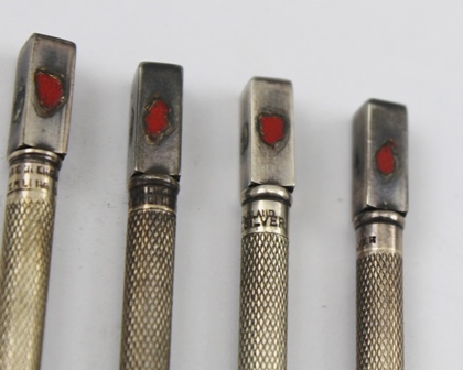A SET OF FOUR SILVER COLOURED METAL AND ENAMEL BRIDGE SUITE MARKERS, each with a knurled shaft, - Image 3 of 4
