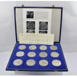 PAUL VINCZE A PRESENTATION SET OF TWELVE SHAKESPEARE COMMEMORATIVE SILVER MEDALLIONS PREPARED BY THE