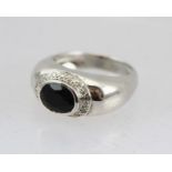 AN 18CT WHITE GOLD JET AND DIAMOND RING, various hallmarks, size O 1/2