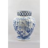 A CHINESE PORCELAIN VASE of lobed form, with pierced collar rim, hand-painted cobalt blue