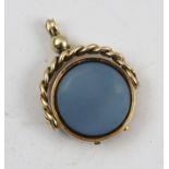 A VICTORIAN SWIVEL FOB/LOCKET with hinge, opening to reveal provision for small momento photograph