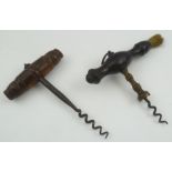 A LATE VICTORIAN CORKSCREW with turned ebonised handle with brush, together with one other corkscrew