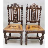 A PAIR OF LATE 19TH CENTURY HALL CHAIRS, assembled from reclaimed carved oak, having pierced and