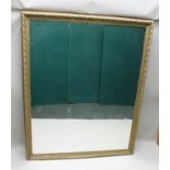 A LATE 19TH CENTURY DECORATIVE GILT GESSO FRAMED WALL MIRROR, plate size 164cm x 130cm