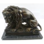 A LATE 20TH CENTURY CAST BRONZED METAL MALE LION AND IT'S PREY, on rectangular plinth, mounted on