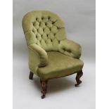 A LATE VICTORIAN BUTTON BACK EASY CHAIR upholstered in pale green fabric, raised on cabriole