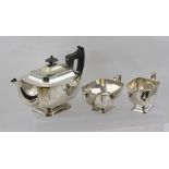 A GEORGIAN DESIGN SILVER PLATED THREE-PIECE TEA SET, comprising teapot, sugar bowl and milk jug