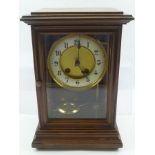 AN EDWARDIAN MAHOGANY CASED EIGHT DAY MANTEL CLOCK fitted glass panel door and glazed side panels,