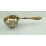 MARLOW BROTHERS A LATE 20TH CENTURY SILVER TEA STRAINER of Georgian design, having gadrooned rim