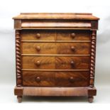 A 19TH CENTURY MAHOGANY CHEST OF DRAWERS, having concealed frieze drawer over two short and three