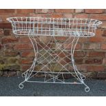 A VICTORIAN STYLE WHITE FINISHED WIRE WORK OVAL PLANTER STAND, supported on decorative frame with