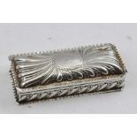 WILLIAM COMYNS AND SONS A LATE 19TH CENTURY EMBOSSED SILVER BOX with hinged cover, blind oval