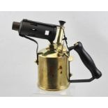 AN EARLY 20TH CENTURY BRASS BLOW TORCH with ebonised handle, 21cm high