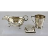 GOLDSMITHS & SILVERSMITHS COMPANY A GEORGIAN DESIGN SILVER SAUCE BOAT, having scroll handle and