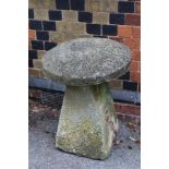 A STADDLE STONE AND CAP, height 70cm