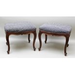 A PAIR OF LATE 19TH CENTURY MAHOGANY FRAMED STOOLS, having serpentine seats upholstered in navy