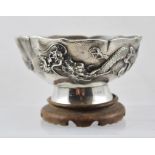 A CHINESE EXPORT SILVER BOWL, hammered finish with raised dragon design in the round, character mark