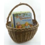 A BASKET OF SEVEN ILLUSTRATED "ALICE IN WONDERLAND" RELATED CHILDREN'S BOOKS