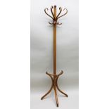 AN EDWARDIAN STAINED BENTWOOD HAT AND COAT RACK, of "half" design to go flush against a wall, with