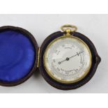 A LATE 19TH/EARLY 20TH CENTURY GILT BRASS CASED POCKET BAROMETER/ALTIMETER, having silvered