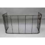 A LATE VICTORIAN MESH NURSERY FIRE GUARD with brass mounted top, 136cm wide x 72cm high