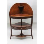 A 19TH CENTURY MAHOGANY CORNER WASHSTAND having gallery back, an under tier fitted central drawer