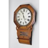 A 19TH CENTURY AMERICAN OAK WALL CLOCK having drop dial case with octagonal bezel, eight day