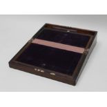 A 19TH CENTURY ROSEWOOD WRITING SLOPE with brass mounted corners and petal shape brass blind