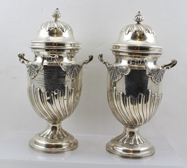 CHARLES STUART HARRIS A PAIR OF LATE 19TH CENTURY SILVER PRESENTATION VASES with covers, having