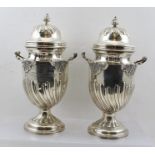 CHARLES STUART HARRIS A PAIR OF LATE 19TH CENTURY SILVER PRESENTATION VASES with covers, having