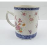 A LATE 18TH CENTURY CHINESE PORCELAIN EXPORT TANKARD, painted with flowers in the famille rose