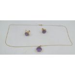 A SUITE OF AMETHYST JEWELLERY comprising a circular single stone amethyst pendant on gold chain