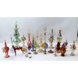 A COLLECTION OF BLOWN GLASS MURANO SCENT BOTTLES, various shapes and colours, with gilding,