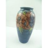 A MOORCROFT POTTERY VASE, cobalt blue ground, tube lined and painted with anemone decoration,