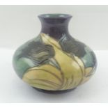 A LATE 20TH CENTURY MOORCROFT POTTERY VASE of squat form, tube lined and glazed in "Black Tulip"