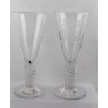 TWO LARGE GEORGIAN DESIGN DRINKING GLASSES, having conical bowls on twisted stems on platform bases,