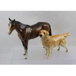 A BESWICK CERAMIC STANDING HORSE in gloss glaze, together with a Beswick Retriever dog (2)