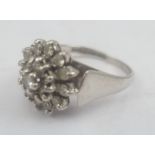 AN 18CT WHITE GOLD DIAMOND CLUSTER RING, stamped .750