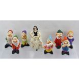 A SET OF SNOW WHITE AND THE SEVEN DWARFS in polychrome painted pottery Snow White is 11cm high