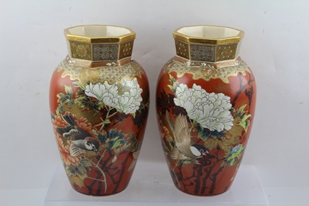 A PAIR OF JAPANESE SATSUMA POTTERY VASES of orange red ground, painted and gilded with birds midst