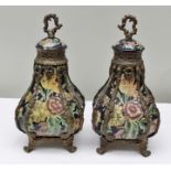 A PAIR OF FLORAL DECORATED PORCELAIN LIDDED POTS with applied cast metal mounts, 29cm high