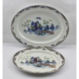 A GRADUATED PAIR OF LAWLEYS POTTERY OVAL MEAT PLATTERS, decorated in a polychrome chinoiserie